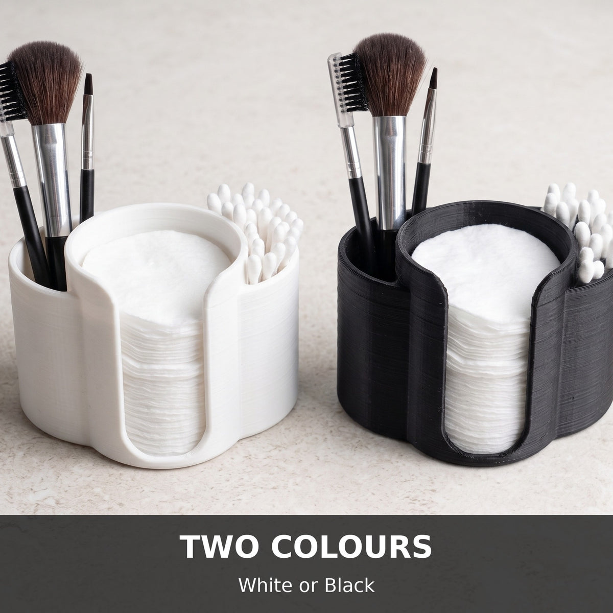 White and black cotton pad and Q-tip holders side by side showing both colour options