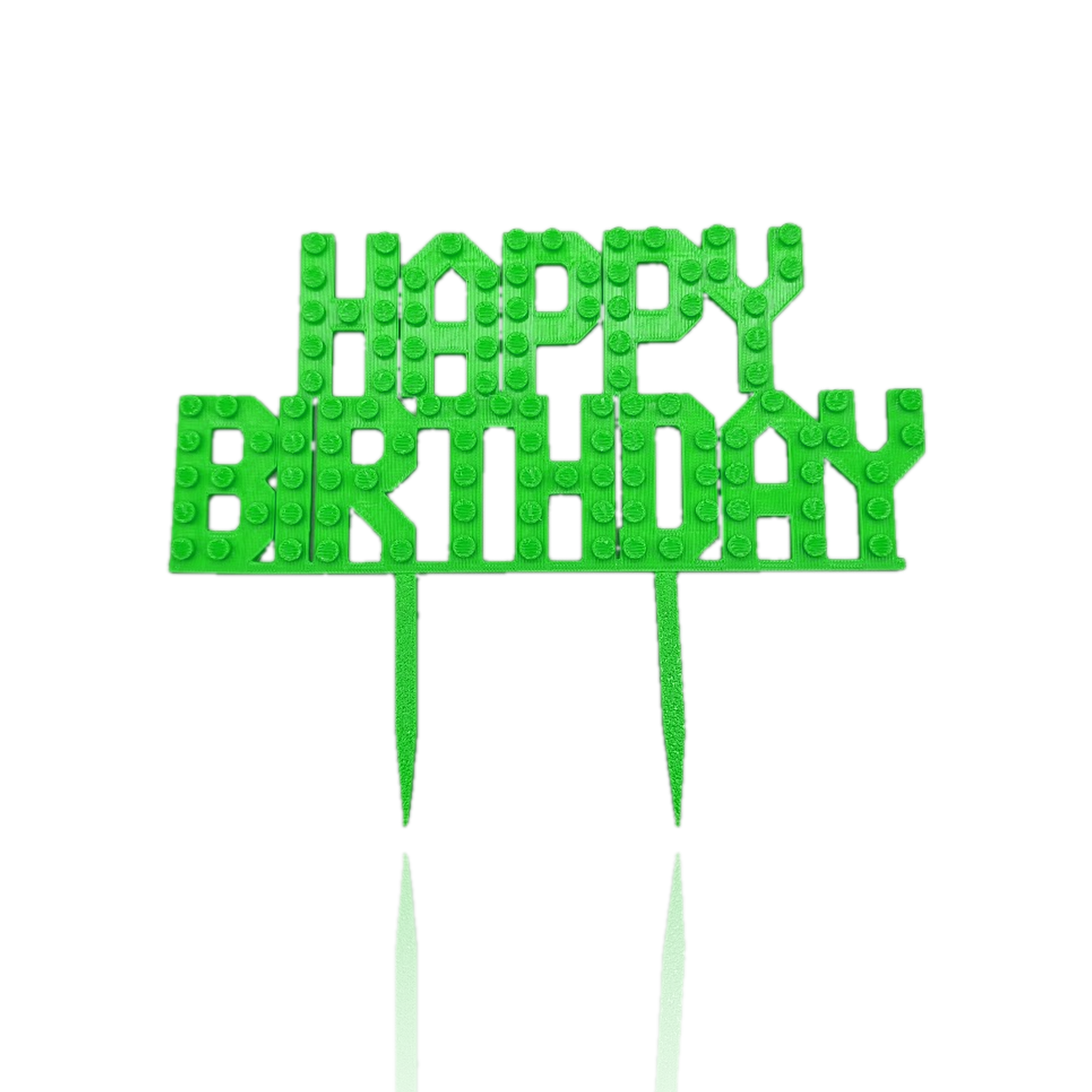 Green 3D printed brick-stud Happy Birthday cake topper with raised lettering, building blocks party cake decoration, on white background