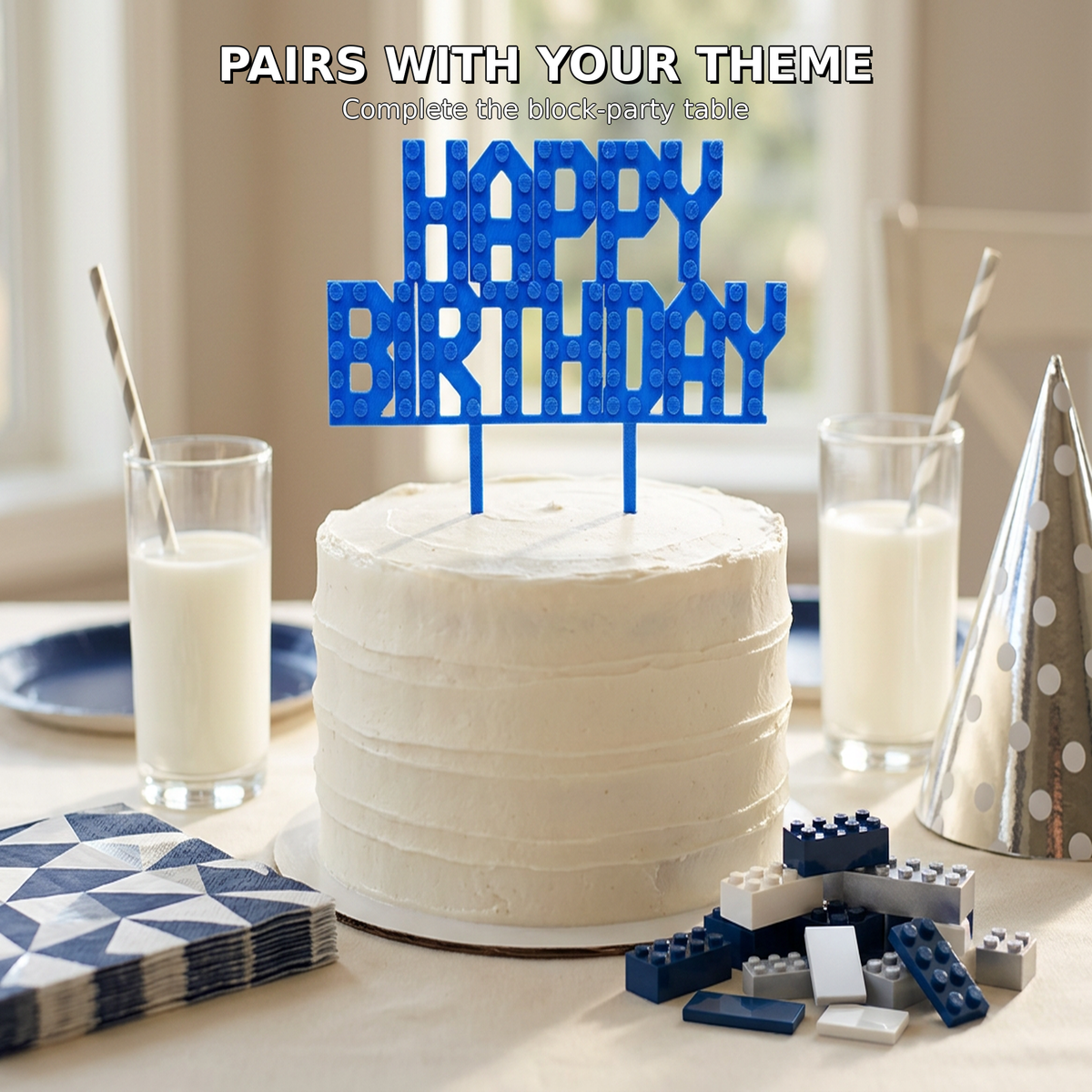 Blue Happy Birthday cake topper with navy toy building blocks and matching party tableware